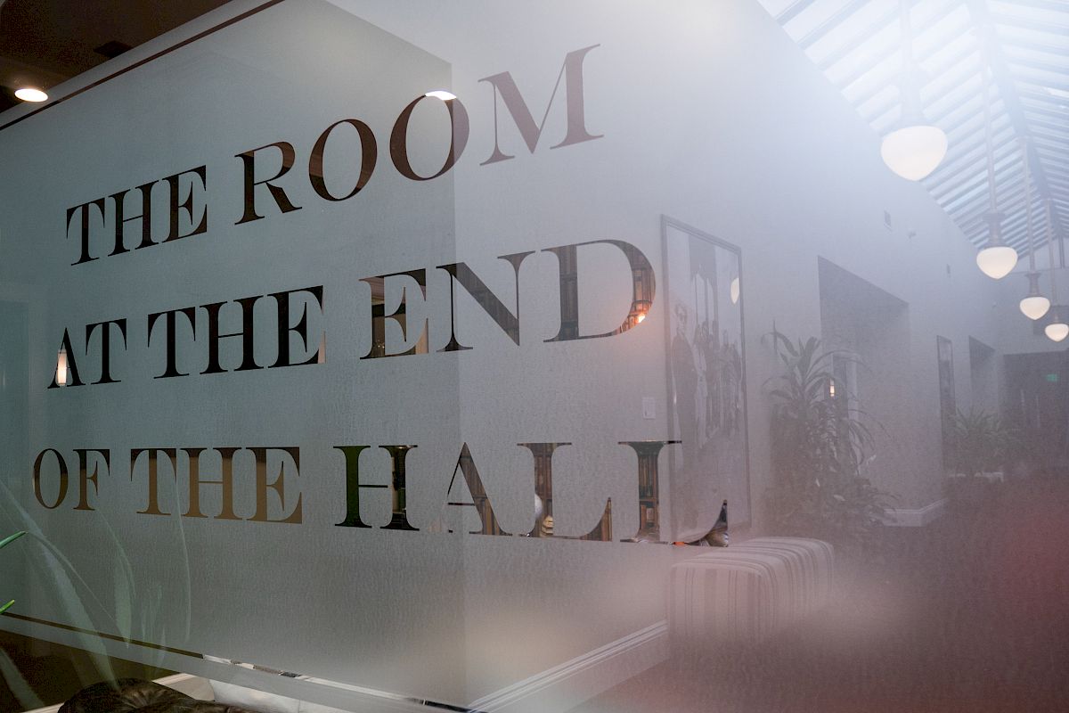 A frosted glass wall with the text 