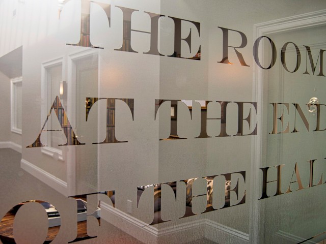 A glass door with the words 